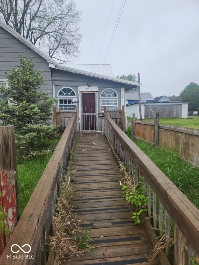 view of exterior entry featuring metal roof