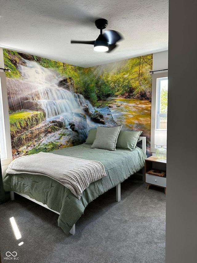 426 St Paul St, Indianapolis, IN 46201 - carpeted bedroom with a textured ceiling and a ceiling fan