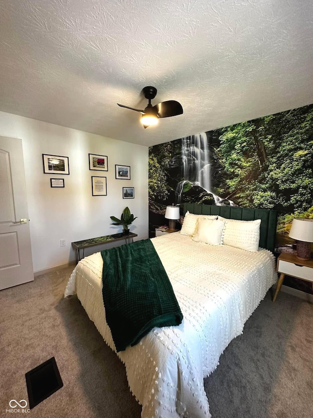 426 St Paul St, Indianapolis, IN 46201 - bedroom with carpet, ceiling fan, a textured ceiling, and baseboards