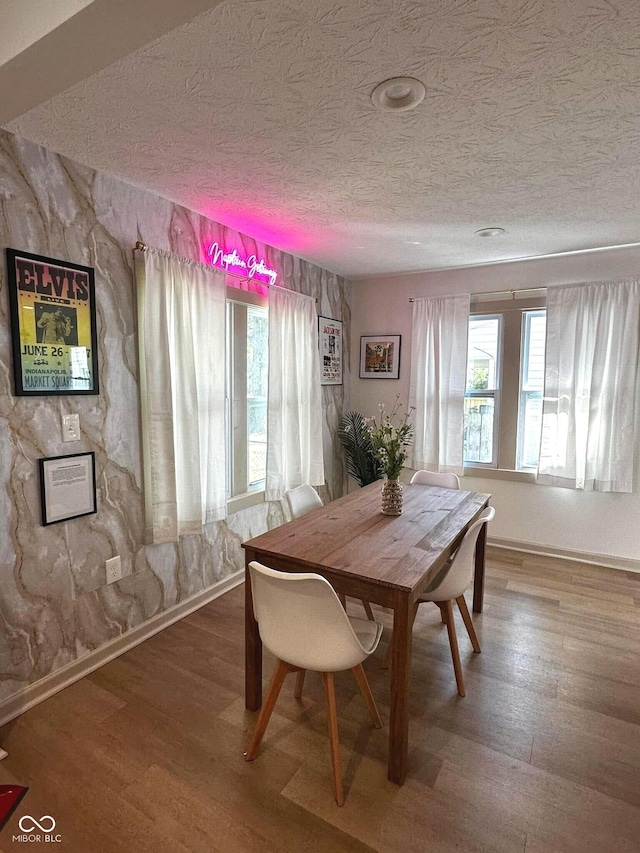 426 St Paul St, Indianapolis, IN 46201 - dining space with a textured ceiling, wood finished floors, and baseboards