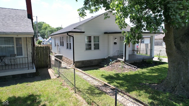 426 St Paul St, Indianapolis, IN 46201 - view of front of property featuring a fenced backyard and roof with shingles