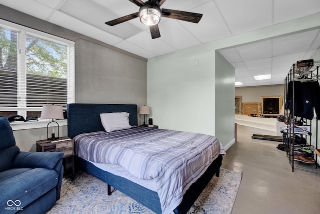 bedroom featuring a paneled ceiling and a ceiling fan