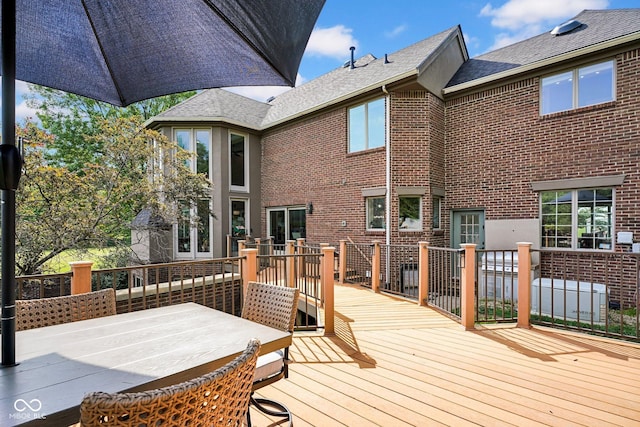 deck with outdoor dining area