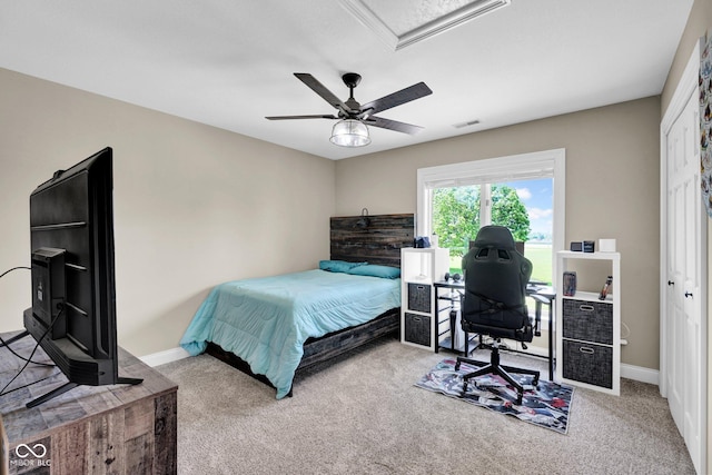 bedroom with carpet flooring, ceiling fan, baseboards, and a desk
