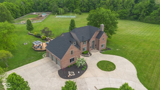 view of subject property featuring a heavily wooded area