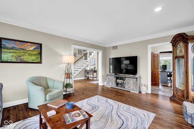 living area with baseboards, crown molding, stairs, wood finished floors, and recessed lighting