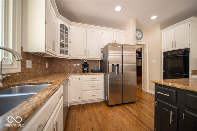 11536 Woods Bay Ln, Indianapolis, IN 46236 - kitchen with stainless steel appliances, a sink, white cabinetry, light stone counters, and glass insert cabinets