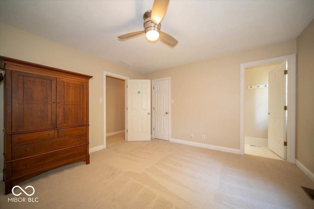 11536 Woods Bay Ln, Indianapolis, IN 46236 - unfurnished bedroom featuring light colored carpet, baseboards, and a ceiling fan