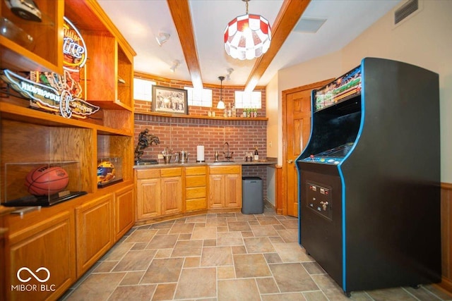 11536 Woods Bay Ln, Indianapolis, IN 46236 - kitchen featuring open shelves, stone finish floors, black refrigerator, a sink, and beam ceiling