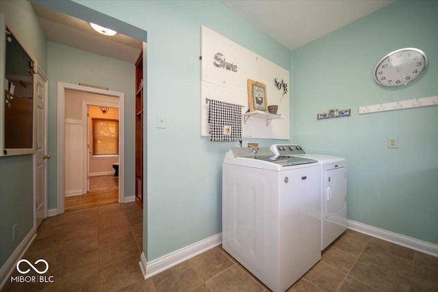 11536 Woods Bay Ln, Indianapolis, IN 46236 - laundry room featuring washing machine and dryer, baseboards, and tile patterned flooring