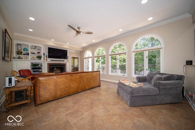 11536 Woods Bay Ln, Indianapolis, IN 46236 - living room featuring a brick fireplace, ceiling fan, recessed lighting, crown molding, and baseboards