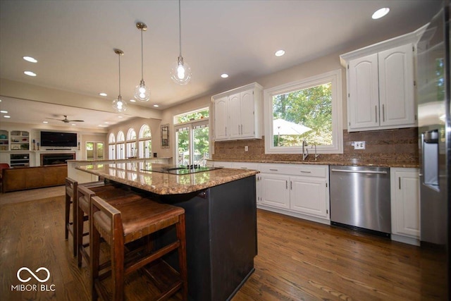 11536 Woods Bay Ln, Indianapolis, IN 46236 - kitchen with appliances with stainless steel finishes, recessed lighting, white cabinetry, open floor plan, and light stone countertops