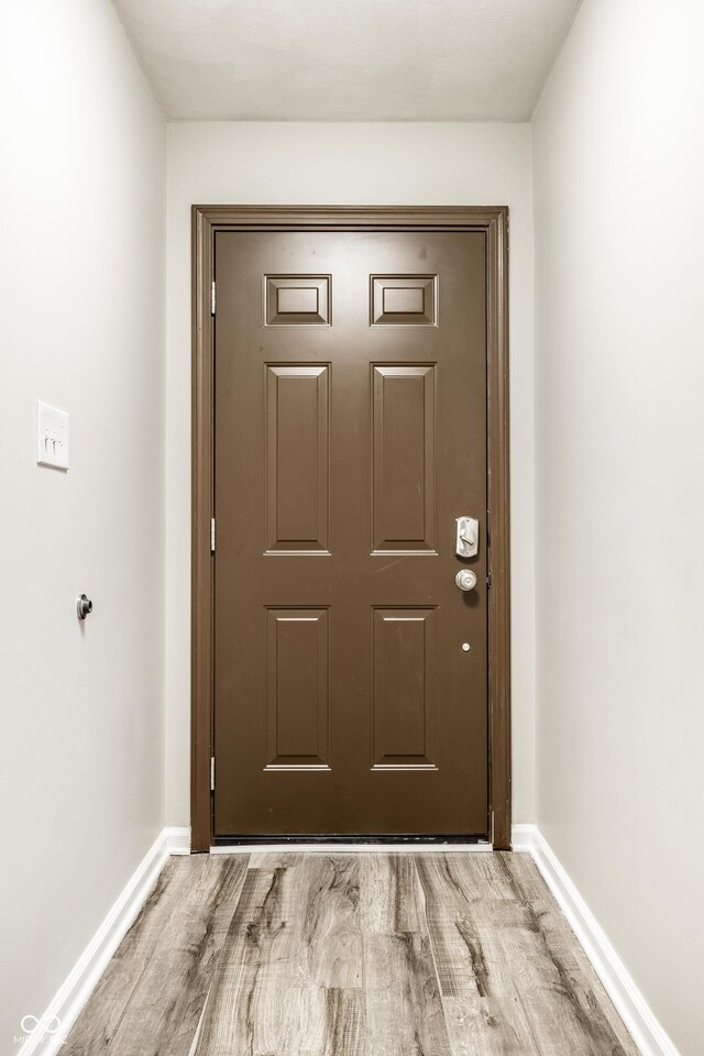 8510 E Mcgregor Rd, Indianapolis, IN 46259 - doorway to outside featuring wood finished floors and baseboards