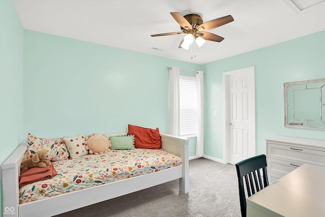 bedroom with light colored carpet, baseboards, and a ceiling fan