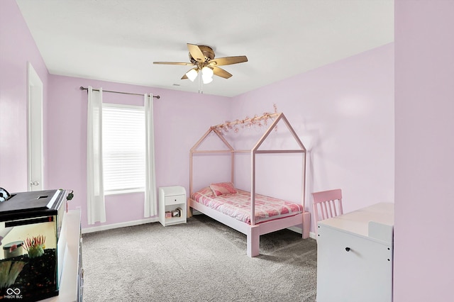 bedroom with carpet flooring, baseboards, and ceiling fan