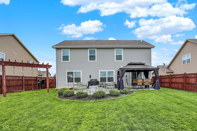 rear view of house with a gazebo and a patio area