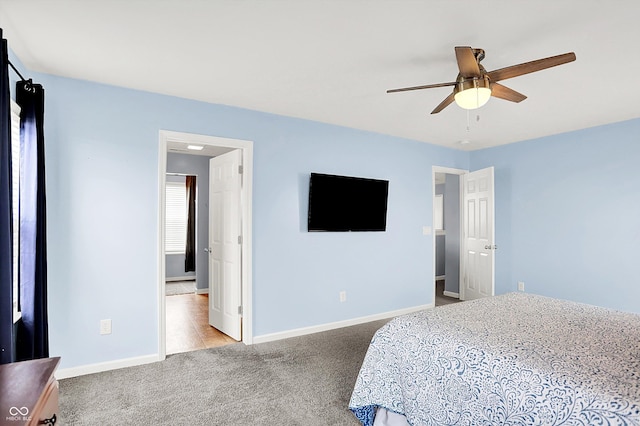 carpeted bedroom with baseboards and ceiling fan