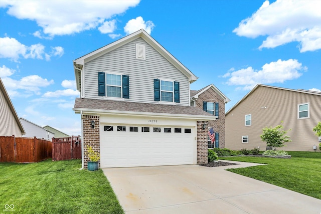 traditional home with brick siding, an attached garage, and concrete driveway