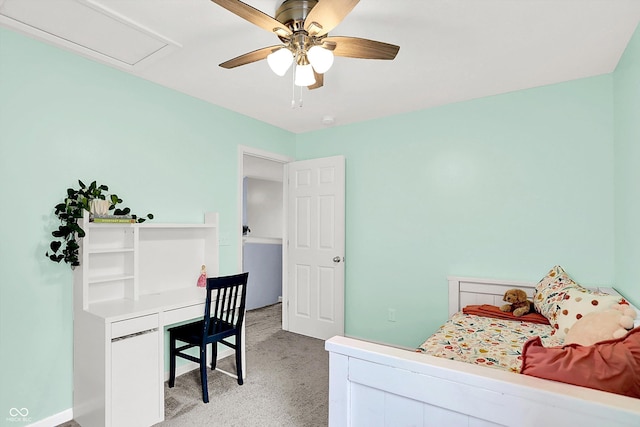 bedroom featuring light carpet, a ceiling fan, and baseboards