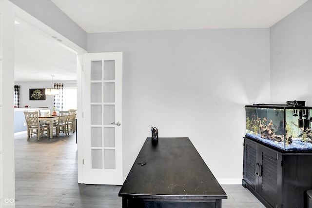 office space featuring wood finished floors and baseboards