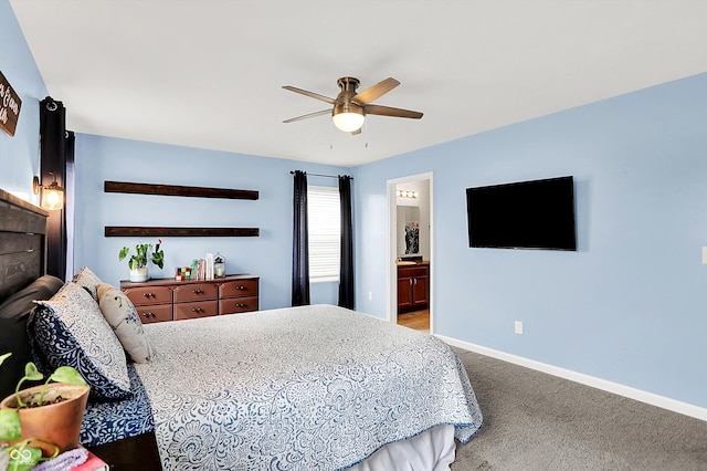 bedroom with baseboards, carpet floors, ceiling fan, and ensuite bathroom