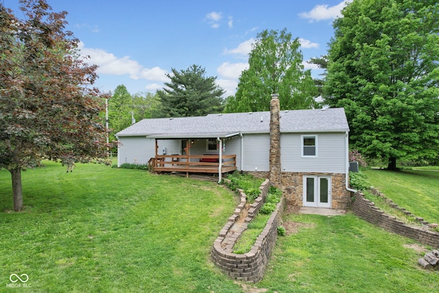 8513 S 575 W, Morgantown, IN 46160 - rear view of house featuring a deck, stone siding, a yard, a chimney, and french doors