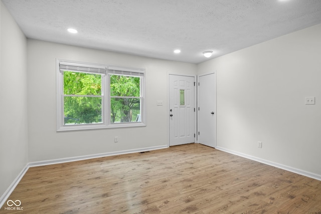 8513 S 575 W, Morgantown, IN 46160 - foyer entrance with a textured ceiling, wood finished floors, and recessed lighting