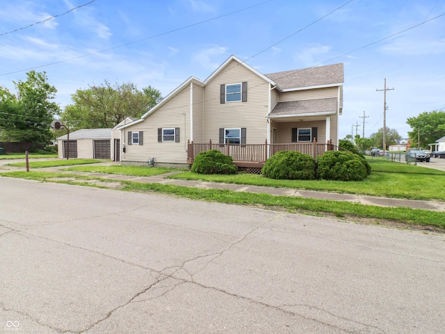 1225 S Monroe St, Muncie, IN 47302 - traditional-style home with a garage, a front yard, and a shingled roof