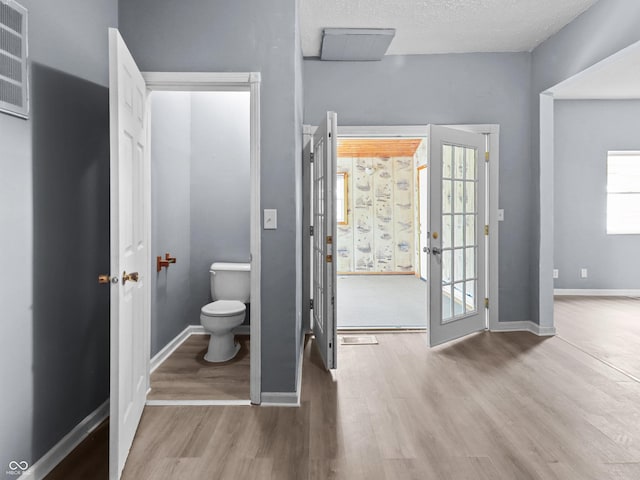 1225 S Monroe St, Muncie, IN 47302 - foyer entrance featuring wood finished floors and baseboards