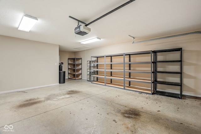 11438 Winding Wood Dr, Indianapolis, IN 46235 - garage featuring a garage door opener and baseboards