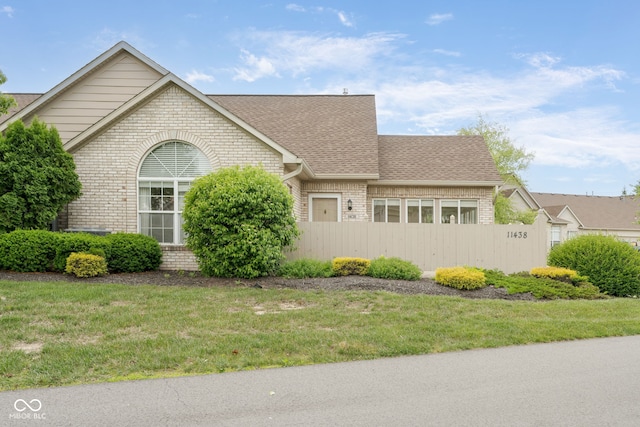 11438 Winding Wood Dr, Indianapolis, IN 46235 - view of front of home featuring brick siding and roof with shingles