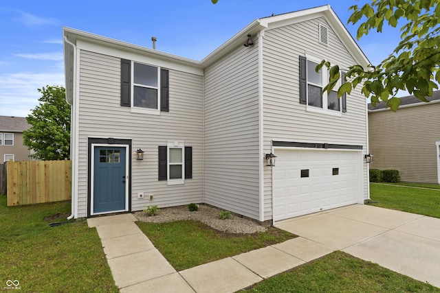 traditional home featuring an attached garage and concrete driveway