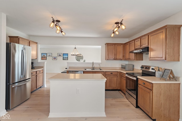 8238 Crackling Ln, Indianapolis, IN 46259 - kitchen featuring stainless steel appliances, a sink, under cabinet range hood, and light countertops