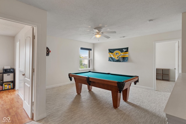 8238 Crackling Ln, Indianapolis, IN 46259 - playroom featuring ceiling fan, billiards, a textured ceiling, baseboards, and light colored carpet