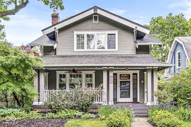 5002 Broadway St, Indianapolis, IN 46205 - view of front facade with covered porch, a chimney, and ceiling fan