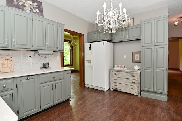 6567 Kings Ct, Avon, IN 46123 - kitchen featuring white fridge with ice dispenser, dark wood-type flooring, gray cabinets, backsplash, and a textured ceiling