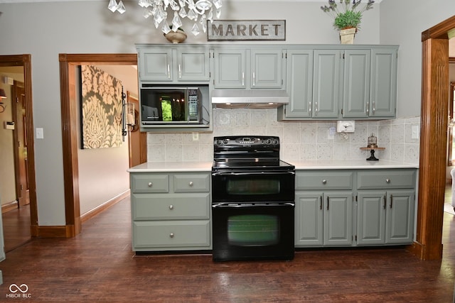 6567 Kings Ct, Avon, IN 46123 - kitchen with double oven range, built in microwave, under cabinet range hood, light countertops, and backsplash