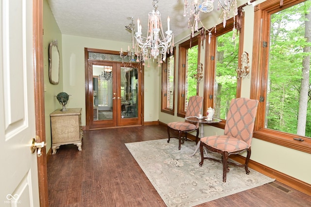 6567 Kings Ct, Avon, IN 46123 - living area with french doors, dark wood-type flooring, and a chandelier