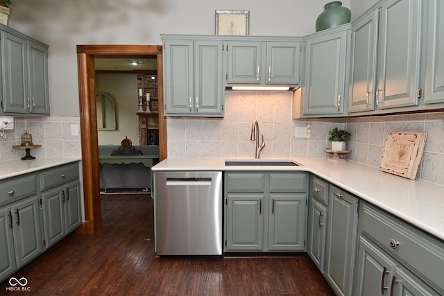 6567 Kings Ct, Avon, IN 46123 - kitchen featuring dishwasher, gray cabinets, light countertops, dark wood finished floors, and tasteful backsplash