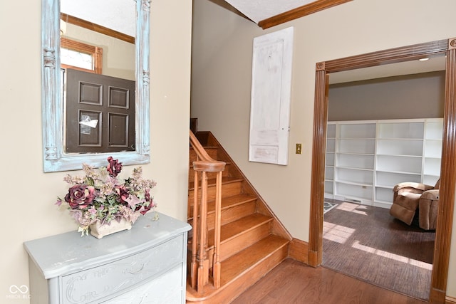 6567 Kings Ct, Avon, IN 46123 - staircase with wood finished floors and ornamental molding