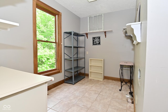 6567 Kings Ct, Avon, IN 46123 - washroom featuring light tile patterned flooring and a textured ceiling
