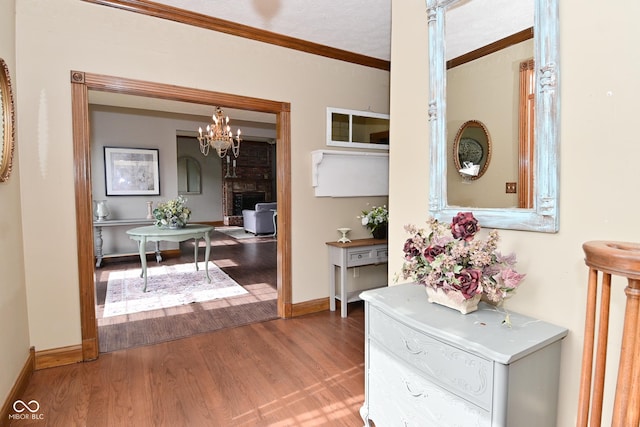 6567 Kings Ct, Avon, IN 46123 - hall with wood finished floors, crown molding, and a chandelier
