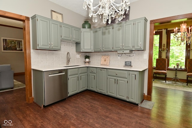 6567 Kings Ct, Avon, IN 46123 - kitchen with a chandelier, stainless steel dishwasher, dark wood-style flooring, and light countertops