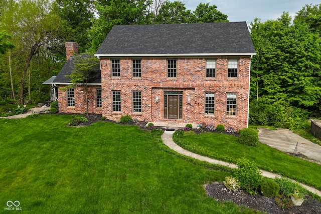 6567 Kings Ct, Avon, IN 46123 - colonial inspired home featuring a chimney, a front lawn, roof with shingles, and brick siding