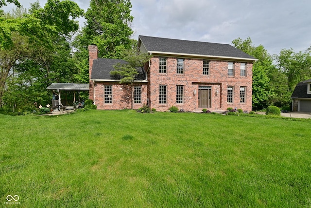 6567 Kings Ct, Avon, IN 46123 - view of front facade featuring a chimney, a front lawn, brick siding, and a garage