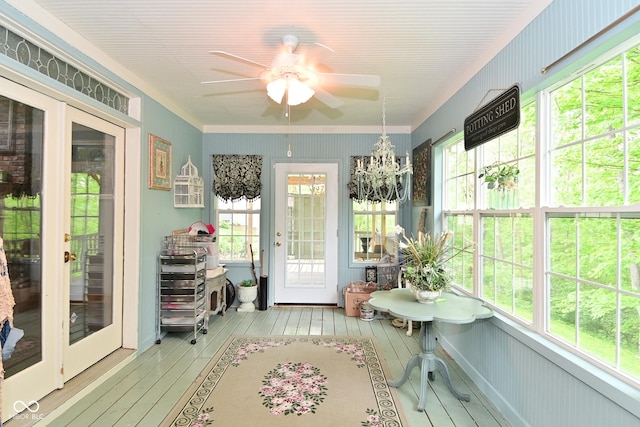 6567 Kings Ct, Avon, IN 46123 - sunroom / solarium featuring french doors, a ceiling fan, hardwood / wood-style floors, ornamental molding, and a chandelier