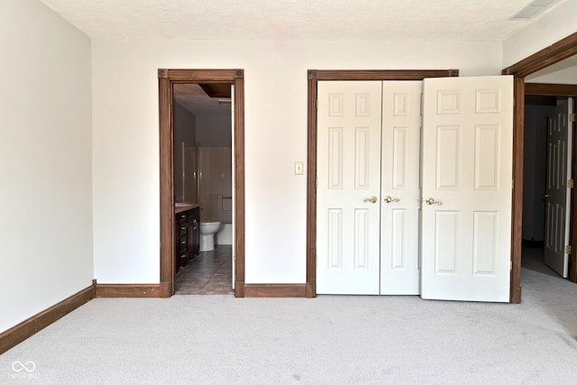 6567 Kings Ct, Avon, IN 46123 - unfurnished bedroom with carpet floors, a closet, and connected bathroom