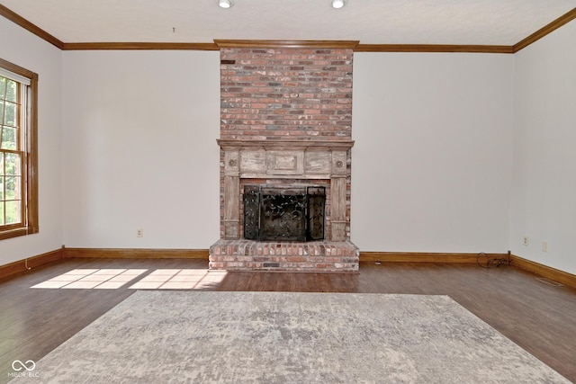 6567 Kings Ct, Avon, IN 46123 - unfurnished living room with wood finished floors, crown molding, a fireplace, and recessed lighting