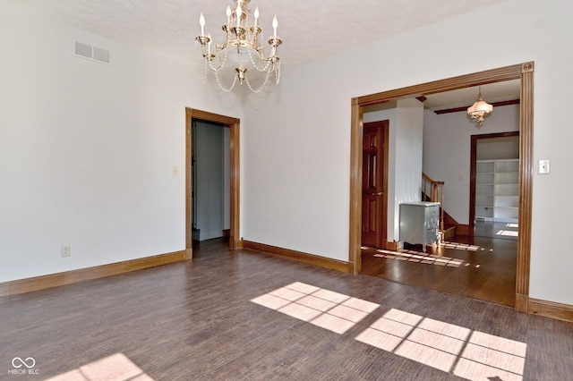 6567 Kings Ct, Avon, IN 46123 - unfurnished dining area featuring a chandelier, wood finished floors, and stairway