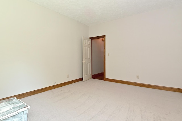 6567 Kings Ct, Avon, IN 46123 - spare room featuring light carpet and a textured ceiling